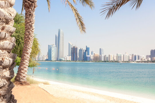 UAE, Abu Dhabi, palm, beach and skyline