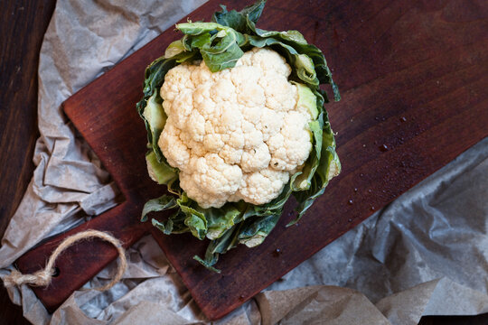 White cauliflower on chopping board