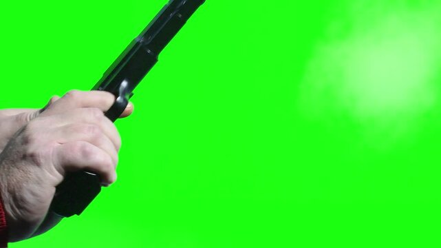 Gunshot action on green screen with chromakey close up