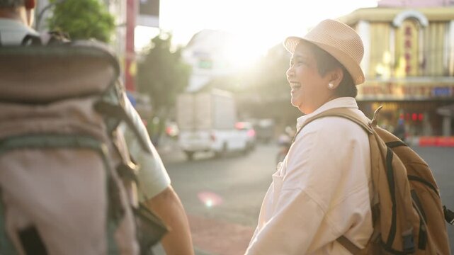 Asian senior couple traveler traveling and exploring the city outdoors. 