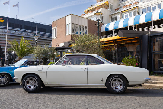 white 1965 air cooled chevrolet corvair coupe