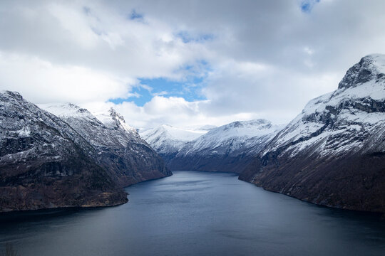 A beautiful viewpoint between Hellesylt and Stranda towards Geirangerfjord. A springtime scenery in Sunnmore Alps, More og Romsdale, Norway.