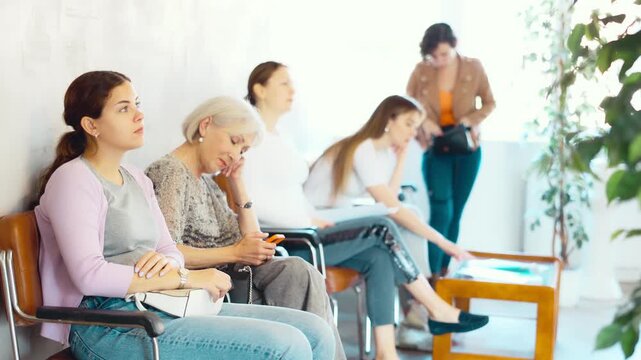 Young woman waiting in line at reception