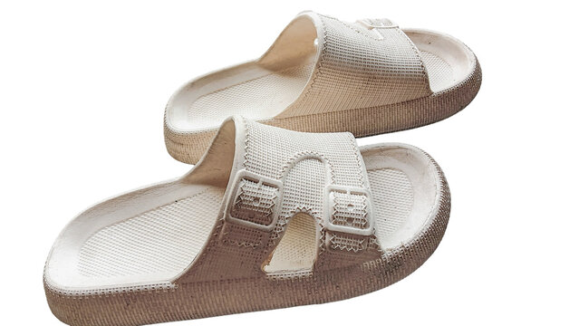 Pair of comfortable white rubber slide sandals isolated on a clean white background.