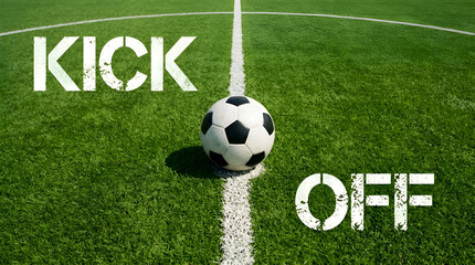 Obraz premium A classic soccer ball rests perfectly on the pristine white center line of a vibrant green grass football field, set for the exhilarating commencement of a match