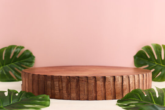 pastel background with leaves and rustic empty table