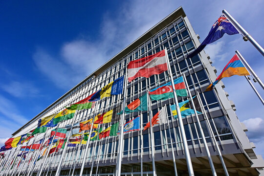 Geneva, Switzerland, Europe - 05.2026 : National flags of members of World Health Organization in front of headquarters building, specialized agency of United Nations