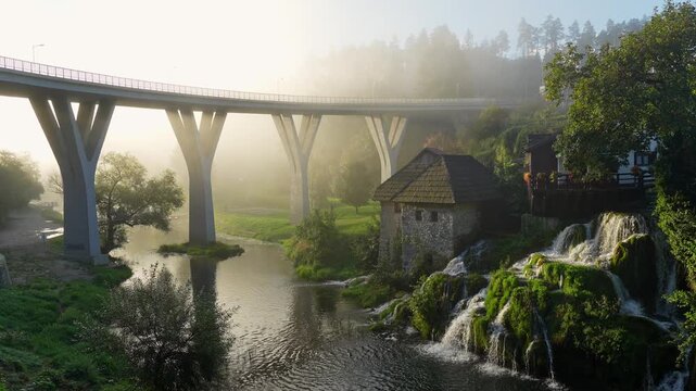 Bridge and water fall on a the small town of Rastoke during golden hour.