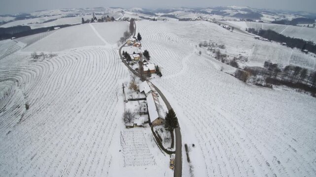 Drone Aerial View of Kog Village in Snowy Winter Countryside, Slovenia