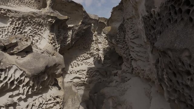Aerial view flying through a strange sandstone canyon, Mangystau, Kazakhstan
