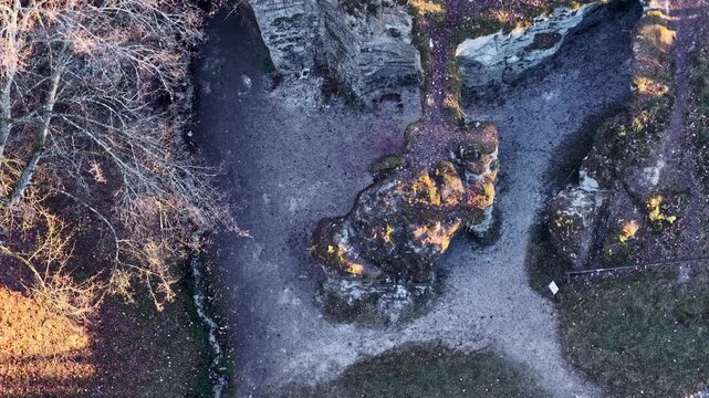 Aerial top down view slowly flying over the Huel Lee rock formations in Berdorf, Luxembourg