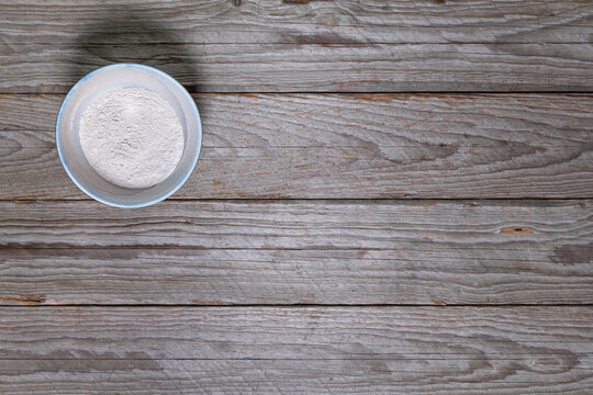 Whole Grain Buckwheat Flour in Rustic Bowl with Copy Space