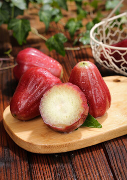 Fresh Red Wax Apples on Wooden Board - Tropical Hainan Fruit with White Flesh