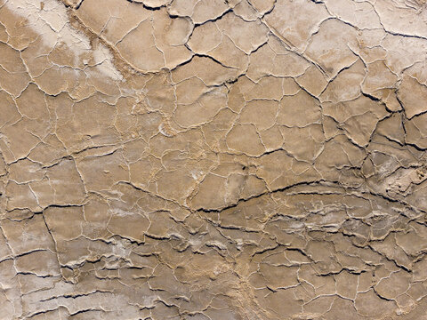 Aerial view of the cracked earth and geometric salt patterns on the surface of the Uyuni Salt Flat Potosi Department, Bolivia.