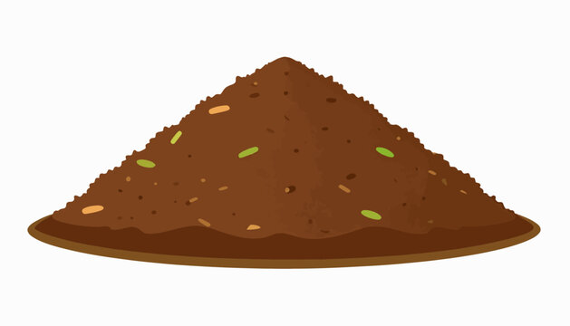 A brown, textured pile of dirt with small flecks of green and orange