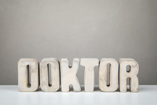 Doctor Concept From German Word DOKTOR Displayed With Concrete Typography