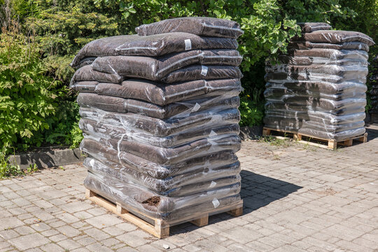 Bulk Garden Mulch Bags Stacked on Pallets for Landscaping Supply
