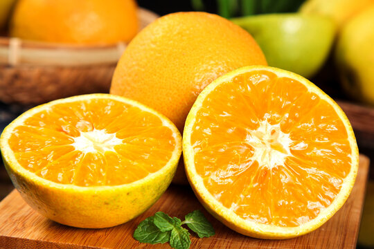 Fresh Orange Halves Cut on Wooden Board - Vitamin Rich Citrus from Zigui Hubei China Summer Fruit