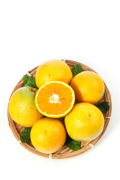 Fresh Zigui Orange Citrus Fruits Cut in Half Showing Vitamin Rich Flesh in Wicker Basket Summer Harvest Hubei China