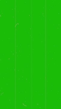Green background with white specks and lines on a textured surface