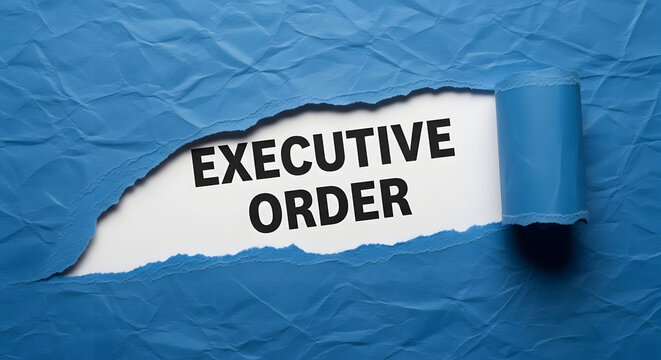 Torn blue paper reveals black text executive order on white background ripped