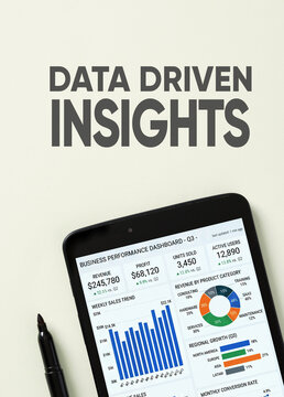 Data driven insights text with business performance dashboard on tablet screen