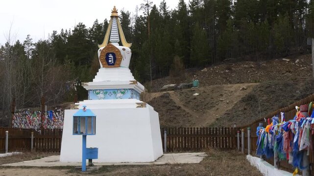 Severobaikalsk, Russia - May 10, 2025: Buddhist stupa on the shore of Lake Baikal in early spring.