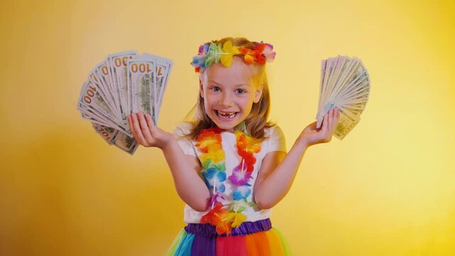 Happy Little Girl Revealing Face Behind Dollar Fans And Laughing On Yellow Background