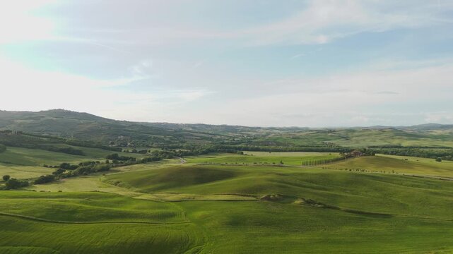 Aerial panorama of rolling green hills in Val d&rsquo;Orcia Tuscany Italy