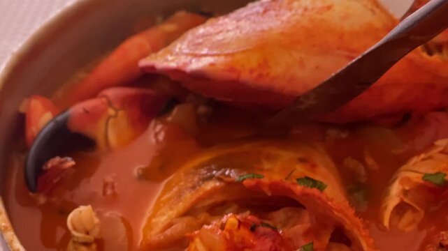Hearty Portuguese seafood stew filled with fresh prawns, fish, and vegetables, ideal for a traditional culinary experience