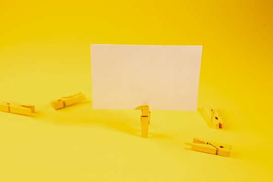 Blank business card on yellow background. Copy space for text.