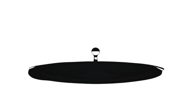 Pot lid with a small central knob rests on a clean white surface for a minimalist kitchen aesthetic.