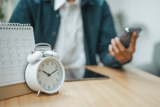Bill reminder and recurring payment management concept with calendar, alarm clock, and smartphone, representing budgeting, financial scheduling, expense tracking, and timely payment organization.