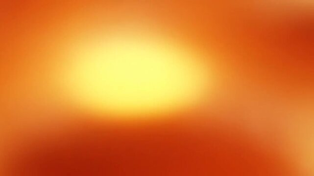 A soft abstract background featuring warm glowing orange and yellow light gradients