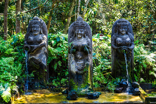 Stone water fountains depicting female figures at the Sacred Monkey Forest Sanctuary in Ubud