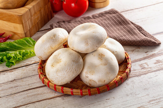 Raw white champignon mush heap