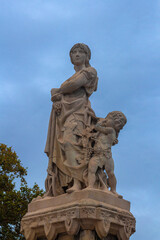 Obraz premium On the streets in Barcelona, public places. Elements of architectural decorations of buildings, sculptures, mythological and religious characters. 