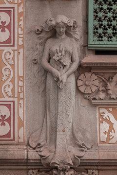 elements of architectural decorations of buildings, sculptures, mythological and religious characters, on the streets in Barcelona, public places.