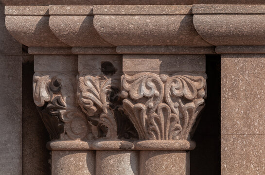 Elements of architectural decorations of buildings, columns and tops, gypsum stucco molding, wall texture and patterns. On the streets in Barcelona, public places.	