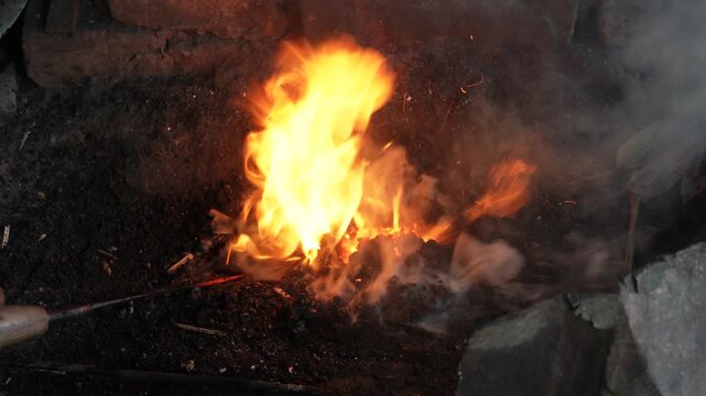 Blacksmith forge glowing with burning coals