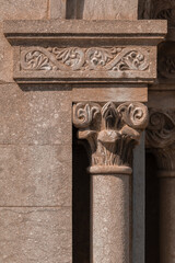 elements of architectural decorations of buildings, ancient arches and columns, pommel and patterns, on the streets in Catalonia, public places. © Kozlik_mozlik