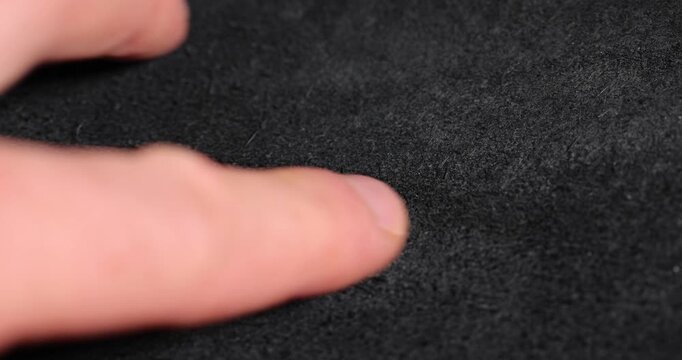 Close-up leather texture, dark grainy natural leather texture with glossy highlights and deep shadows with clear details and authentic surface appearance.