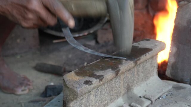 Blacksmith forging hot metal knife with skilled craftsmanship