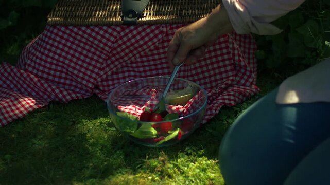 Preparing salad fresh vegatables on vintage picnic basket