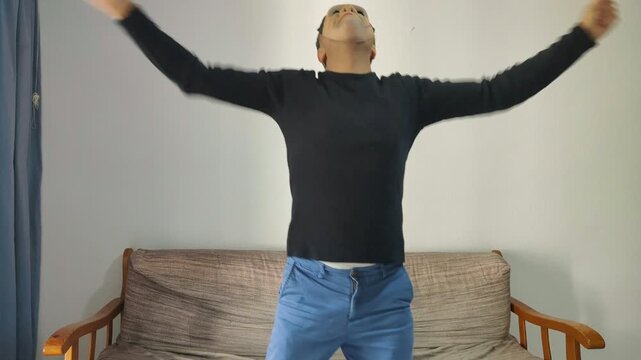 Frankenstein monster mask person dancing at home