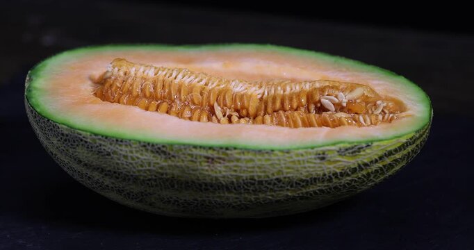 ripe juicy orange melon cut into pieces on a cutting board, sweet pumpkin with juicy soft orange flesh cut into pieces, cut out