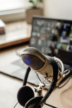 Microphone on the air and headphones for video conference calling on laptop computer