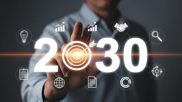 Businessman pointing to futuristic digital screen displaying the year 2030 with business icons