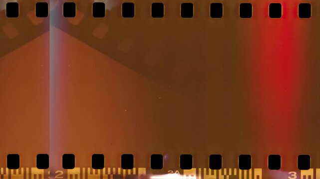 Abstract red and blue vertical light streak leak effect inside a classic celluloid cinema strip video editing motion graphics footages clip assets footage digital retro classic design layout.