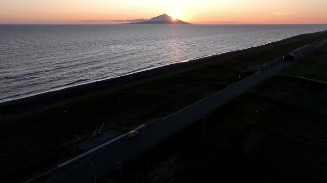 4K Drone Aerial: Sunset over Mount Rishiri and 45th Parallel North Monument on Hokkaido Ororon Line